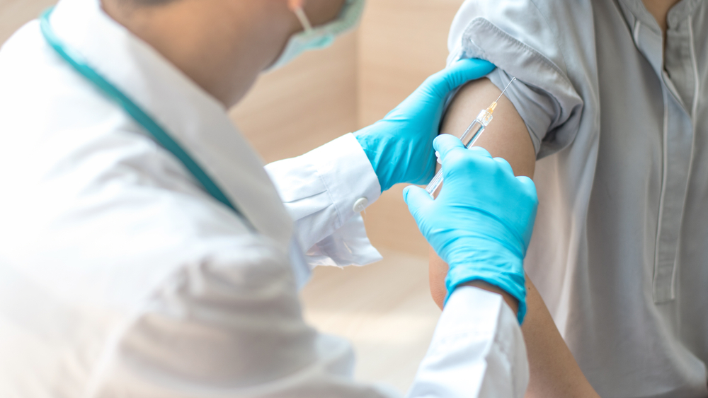 Ear Nose Throat Specialists, PC -  - Doctor preparing to give an allergy shot to a patient - Dr. Goldberg - Chronic Sinus Infections and Allergy Shots - 